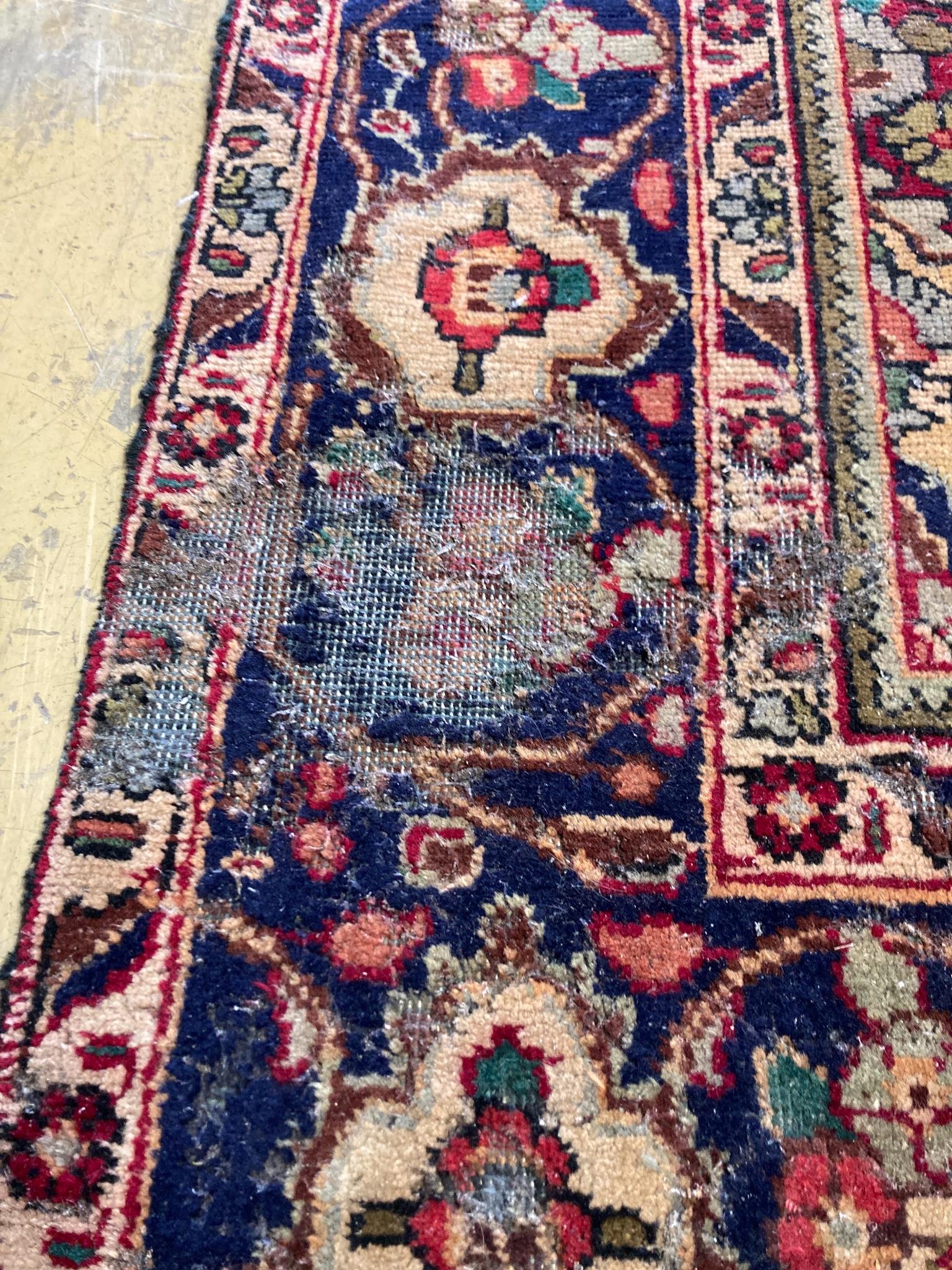 A North West Persian design blue ground carpet, 284 x 196cm